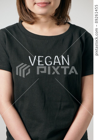 A young vegan woman standing in a T-shirt A young vegan woman standing in a T-shirt 89261455