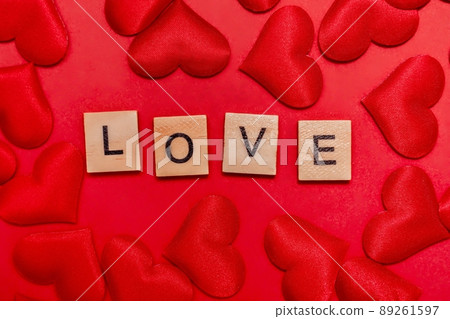 Top view of the inscription with the word love on a red background. Love concept, valentine's day. Top view of the inscription with the word love on a red background. Love concept, valentine's day. 89261597
