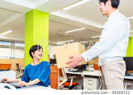 Business woman receiving parcels 89264122