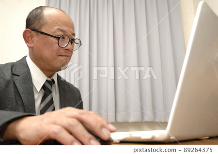 PC and middle-aged man PC and middle-aged man 89264375