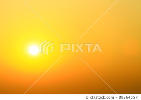 a Sunset with clear sky, with orange and yellow color. 89264557