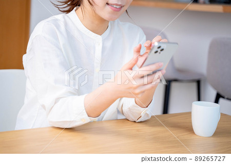 Young woman living lifestyle coffee smartphone Young woman living lifestyle coffee smartphone 89265727
