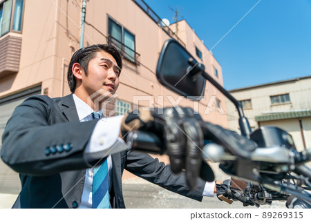 Office worker commuting by motorcycle Tokyo 89269315
