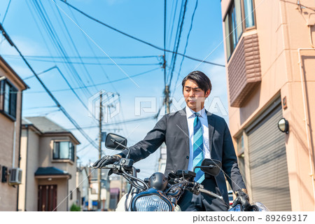 Office worker commuting by motorcycle Tokyo 89269317