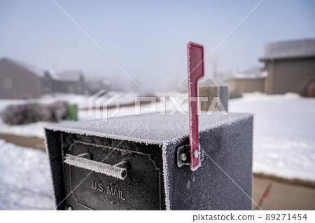 Morning frost covering a mailbox in an early morning winter Morning frost covering a mailbox in an early morning winter 89271454