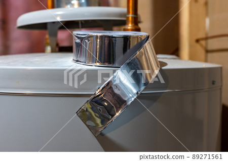 selective focus on the edge of a roll of metallic aluminum foil HVAC duct tape 89271561