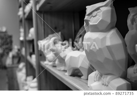 Row of blank unfinished ceramic figures on a studio shelf in a DIY store for painting. Row of blank unfinished ceramic figures on a studio shelf in a DIY store for painting. 89271735