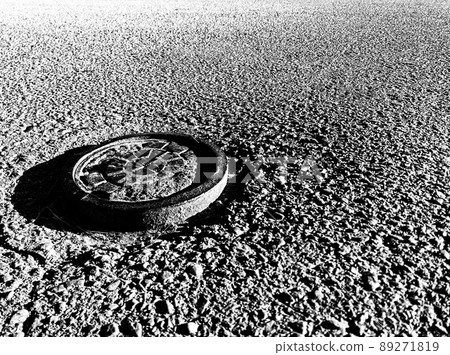 Low angle view of capped water main in residential street 89271819