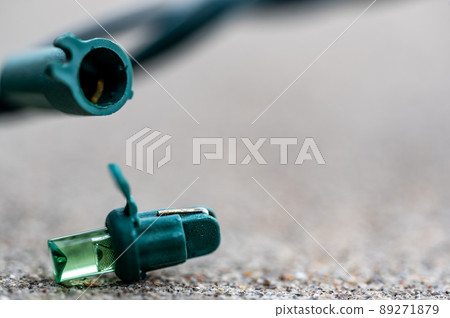 Focus on replacement bulb for a string of Christmas lights to repair a dud.  89271879