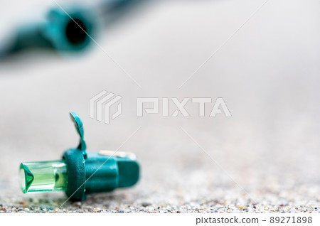 Focus on replacement bulb for a string of Christmas lights to repair a dud.  89271898