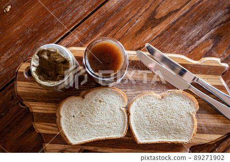 selective focus on butter knife edge used to spread a sunflower butter  89271902