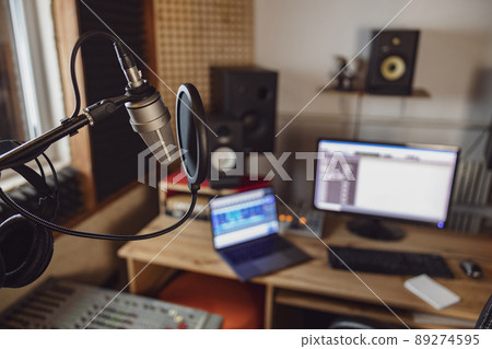 Close-up of the sound engineer, radio presenter office in recording and broadcasting studio. Focus on microphone 89274595