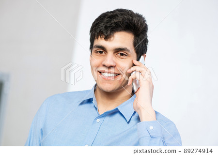 portrait of a man talking on the phone portrait of a man talking on the phone 89274914