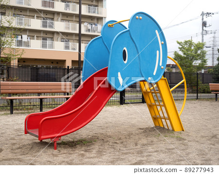 Playground equipment slide in the park 89277943