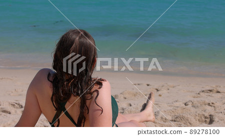 Pretty girl relaxing at the beach on her summer vacation in Florida 89278100
