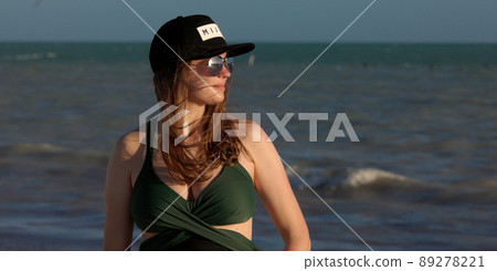 Portrait shot of a happy girl having a vacation in Miami Portrait shot of a happy girl having a vacation in Miami 89278221
