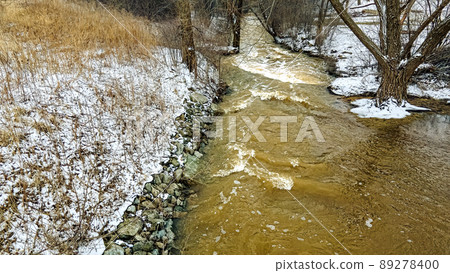 A fast moving river during snow melting season 89278400