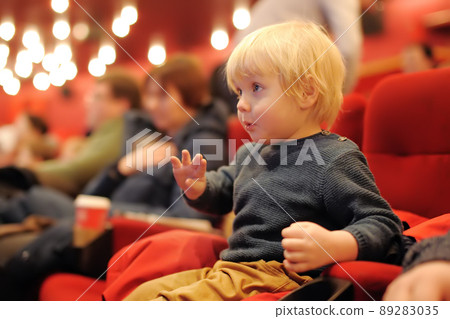 Cute toddler boy watching cartoon movie in the cinema. Leisure/entertainment for kids. 89283035