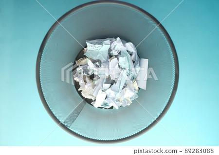 crumpled paper ball in a bin top view crumpled paper ball in a bin top view 89283088