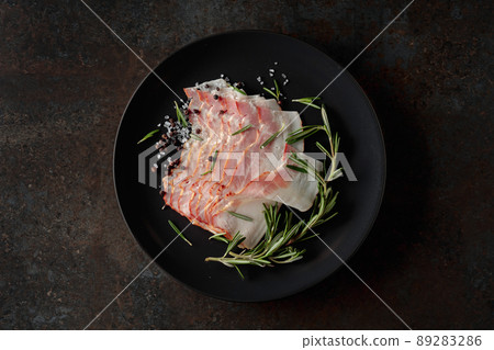 Bacon with rosemary, salt, and pepper. 89283286