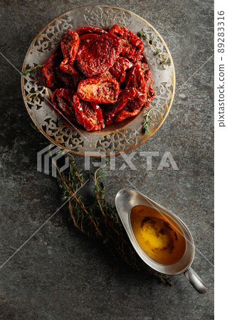 Sun-dried tomatoes in olive oil. Sun-dried tomatoes in olive oil. 89283316