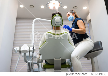 Man at dental check-up. Patient at the dentist's appointment 89284912