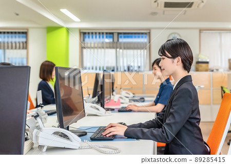 Woman working in the office 89285415