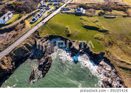 Aerial view of the sunny rocky coast of Portnablagh, Co. Donegal, Ireland Aerial view of the sunny rocky coast of Portnablagh, Co. Donegal, Ireland 89285426