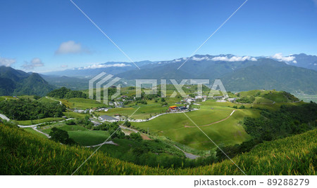 Sunny view of the orange daylily blossom over the Sixty Stone Mountain Sunny view of the orange daylily blossom over the Sixty Stone Mountain 89288279
