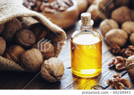Walnuts. Bottle of essential nut oil, sack of walnuts. Walnuts. Bottle of essential nut oil, sack of walnuts. 89289943
