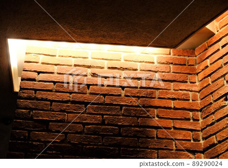 Interior space with antique bricks and indirect lighting Interior space with antique bricks and indirect lighting 89290024