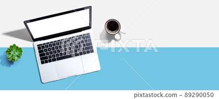 Laptop computer with a coffee cup Laptop computer with a coffee cup 89290050