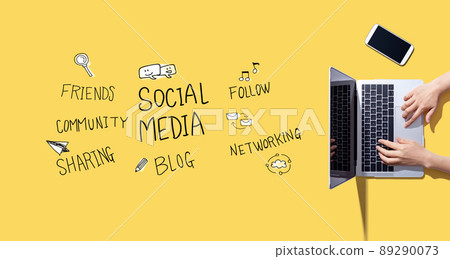 Social media theme with person working with laptop Social media theme with person working with laptop 89290073