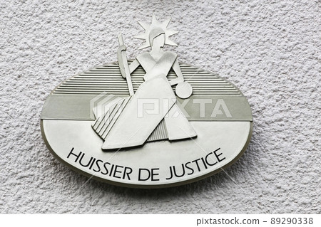 Signboard on a building of the bailiff called huissier de justice in French language 89290338