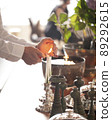 Hands lighting candle in party 89292615