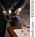 Hand pouring wine in Party 89292616
