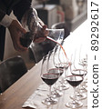 Hand pouring wine in Party 89292617