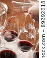 Hand pouring wine in Party 89292618