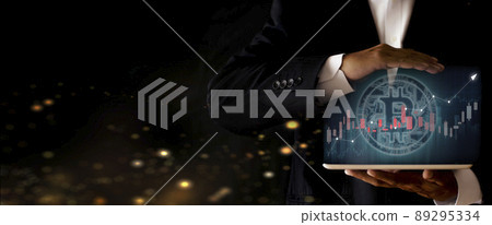 Hands of businessman holding tablet and show bitcoin coin digital graphic. Volatile business graph on network, Financial, Stock market, Cryptocurrency and investment. New Virtual money concept Hands of businessman holding tablet and show bitcoin coin digital graphic. Volatile business graph on network, Financial, Stock market, Cryptocurrency and investment. New Virtual money concept 89295334
