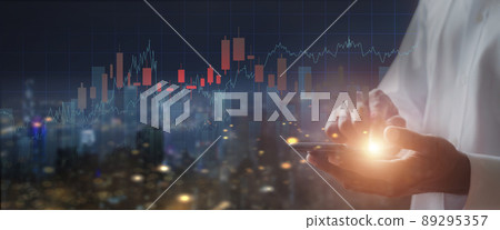 Businessman hand holds mobilephone with stock market chart. Business man analysis screen chart with mobile phone. business stock market concept Businessman hand holds mobilephone with stock market chart. Business man analysis screen chart with mobile phone. business stock market concept 89295357