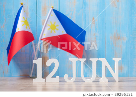 Wooden text of June 12th with Philippines flags. Philippines Independence day and happy celebration concepts Wooden text of June 12th with Philippines flags. Philippines Independence day and happy celebration concepts 89296151