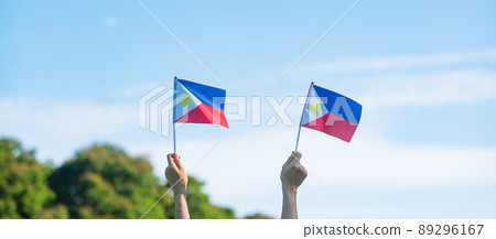 hand holding Philippines flag on nature background. 12th June of Independence day and happy celebration concepts hand holding Philippines flag on nature background. 12th June of Independence day and happy celebration concepts 89296167