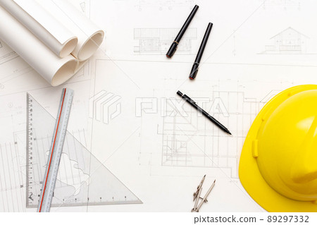 Mockup of architectural concept, Drawing tools and engineer drawing on blueprint with safety helmet Mockup of architectural concept, Drawing tools and engineer drawing on blueprint with safety helmet 89297332