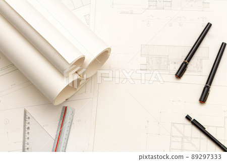 Mockup of architectural concept, Drawing tool and engineer drawing on blueprint with roll blueprint Mockup of architectural concept, Drawing tool and engineer drawing on blueprint with roll blueprint 89297333
