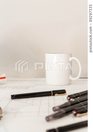 Mockup of architectural concept, Drawing tools and hot coffee on engineer drawing of blueprint Mockup of architectural concept, Drawing tools and hot coffee on engineer drawing of blueprint 89297335