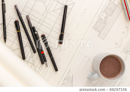 Mockup of architectural concept, Drawing tools and hot coffee on engineer drawing of blueprint Mockup of architectural concept, Drawing tools and hot coffee on engineer drawing of blueprint 89297336