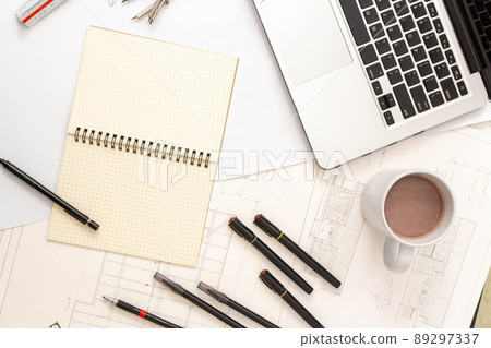 Mockup of architectural concept, Drawing tools and hot coffee on engineer drawing of blueprint Mockup of architectural concept, Drawing tools and hot coffee on engineer drawing of blueprint 89297337