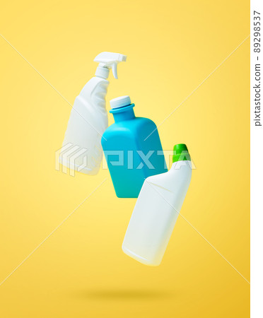 Levitation, falling in air blank household chemical bottles for cleaning the house. Isolated on yellow background. Plastic packaging. Toilet cleaner, detergent sprayer, soap. New brand product mockup 89298537