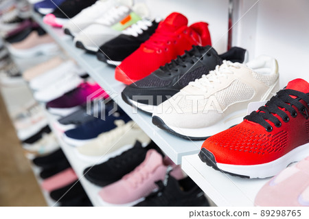 Shelves with sport shoes in shoes shop Shelves with sport shoes in shoes shop 89298765