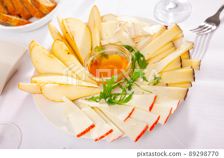 Cheese plate with pears and honey Cheese plate with pears and honey 89298770